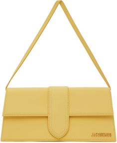 Grained calfskin top handle bag in yellow. Logo hardware at face. · Detachable shoulder strap · Patch pocket at back face · Foldover flap with magnetic press-stud closure · Card slot and leather logo patch at interior · Twill lining in beige · Gold-tone hardware · H5 x W11 x D2.5 in Part of the Le Papier collection. Supplier color: Yellow | Jacquemus Yellow Le Papier ‘Le Bambino Long’ Top Handle Bag Jacquemus Yellow, Jacquemus Bag, Yellow Logo, Best Online Stores, Yellow Shoes, Leather Logo, Small Accessories, Handle Bag, Kate Spade Crossbody