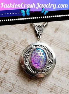 Beautiful Color Shift Locket Blossoms with some of the most precious of shades like Pink Purple Lilac and Aqua. So lovely my dears. Purple Locket, Iridescent Oval Pendant Necklace Gift, Iridescent Cabochon Necklace As Gift, Iridescent Pendant Crystal Necklace For Gift, Spiritual Opal Necklace In Iridescent Color, Iridescent Opal Spiritual Necklaces, Mood Stone, Purple Opal, Pendant Locket