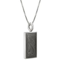 CBM-74 Solidified ashes set into this classically-shaped unisex .925 sterling silver rectangle pendant. It comes with a sterling silver chain in the length and thickness of your choice. Dimensions:24 x 13mm All dimensions are approximate and may vary slightly with every casting. This pendant can be engraved with up to 10 characters, including spaces and simple symbols, in a single line horizontally across its back; a maximum of 10 separate lines can be accommodated. When necessary or upon reques Silver Rectangular Necklace With Polished Finish, Rectangular White Gold Sterling Silver Necklace, White Gold Sterling Silver Rectangular Necklace, Classic Silver Necklace With Rectangular Stone, White Gold Rectangular Box Chain Necklace, Silver Necklaces With Engraved Rectangular Links, Silver Minimalist Necklace With Rectangular Stone, Minimalist Jewelry With Polished Edges Rectangular Shape, Rectangular Necklace With Polished Finish For Formal Occasions