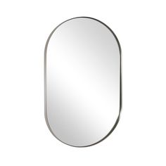 an oval mirror on a white wall with a metal frame in the shape of a half circle