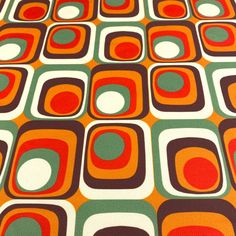 an orange, green and red pattern with circles on it