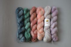 four skeins of yarn in different colors