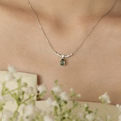 Dance to your own beat and let our Breezy Whisper Moss Agate Necklace be your compass on your way to self-discovery. This necklace features a pear-shaped moss agate pendant that sways in the breeze of a white topaz-accented chain. A show-stopping piece evoking a whimsical and enchanting energy. ✦ 14K White Gold Vermeil (14K white gold plated over a sterling silver base) *Please be informed that your moss agate patterns are naturally distinct and unique from the portrayed picture, and you will ne Moss Agate Necklace, Moss Agate Jewelry, Necklace White Gold, Magical Stones, Lucky Stone, White Gold Necklaces, Necklace White, Agate Necklace, Agate Pendant