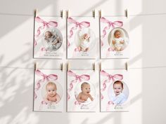 four baby pictures hanging on clothes pins with pink ribbons and bows around them, in front of a white wall