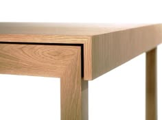 a close up of a wooden table with one drawer