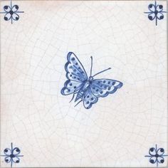 a blue and white tile with a butterfly on it