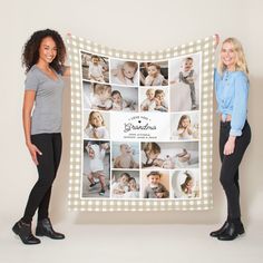 two women standing next to each other holding up a large blanket with photos on it