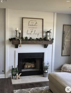 a living room filled with furniture and a fire place in the middle of the room