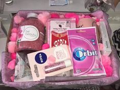 a pink box filled with lots of different items