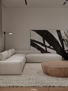 a living room with a large painting on the wall next to a couch and coffee table