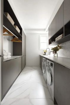 a laundry room with washer and dryer in it