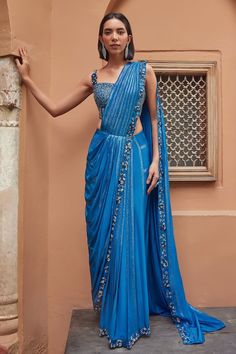 Prussian blue crepe pre-draped saree with bugle beads, glass beads and 3D sequinned flowers hand embroidery. Comes with a satin organza padded blouse. - Aza Fashions Blue Silk Pre-draped Saree In Traditional Style, Blue Pre-draped Saree For Festive Occasions, Blue Embellished Saree With Traditional Drape, Blue Pre-draped Saree With Dupatta For Evening, Elegant Blue Pre-draped Saree For Reception, Blue Pre-draped Saree For Wedding, Blue Pre-draped Saree With Draped Sleeves For Wedding, Blue Pre-draped Saree For Reception, Blue Wedding Pre-draped Saree