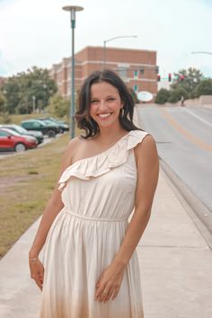 It's all Ombre Skies with this one shoulder ruffle top dress. Fall in love with this maxi length one shoulder dress with an ombre from beige to a dark olive green. We love the elastic band and ruffle top hem detail and we can't forget to mention that bottom hem line that makes you look ten feet tall! Kenzie is 5'6 and is wearing a size small. Spring One Shoulder Dress With Ruffle Hem, One Shoulder Feminine Maxi Dress For Summer, Spring One-shoulder Dress With Ruffle Hem, Feminine One Shoulder Mini Dress For Summer, Feminine One Shoulder Summer Dress For Brunch, Feminine One Shoulder Dress For Summer Brunch, Feminine One-shoulder Dress For Summer Brunch, Feminine One-shoulder Summer Dress For Brunch, Beige One-shoulder Maxi Dress For Summer