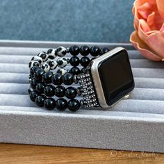 Please note that the length of the bracelet does not include the watch Elevate your Apple Watch with the exquisite IWatch Handmade Replacement Band, a meticulously crafted accessory that seamlessly blends style and functionality. This artisanal watch band is skillfully handmade using premium materials, featuring natural Black Tibetan Mystical Old Onyx and Black Onyx stones that exude timeless sophistication. Designed to provide both comfort and a personalized touch, the band boasts a stretchy elastic construction that wraps effortlessly around your wrist. Tailor the fit to your preference by choosing from two available sizes: the small size connector accommodates 41mm, 40mm, and 38mm Apple Watches, while the large size connector complements 45mm, 44mm, and 42mm models. Immerse yourself in Adjustable Black Beaded Apple Watch Band, Beaded Apple Watch Band Gift, Black Beaded Bracelet With Round Beads, Elegant Black Apple Watch Band For Gift, Elegant Black Apple Watch Band Gift, Elegant Beaded Apple Watch Band As Gift, Elegant Adjustable Apple Watch Band With Round Beads, Handmade Black Apple Watch Band As Gift, Handmade Black Apple Watch Band For Gift