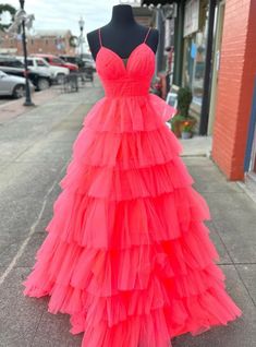 Oenology of charm and grace, this prom dress in a vibrant coral color is designed to turn heads. The cascading tulle layers create a dramatic and whimsical effect, perfect for making a grand statement. The deep V-neckline and thin straps add a touch of sophistication, while the fitted bodice highlights your waist, ensuring a flattering fit. This dress combines modern design with classic elegance, making it a versatile choice for any prom or formal event. With its bold color and exquisite detailing, this dress is sure to make you feel like a star from the moment you step into the room. Prom Dress With Ruffles, Red Spaghetti Strap Dress, Mesh Prom Dress, Tiered Prom Dress, Orange Prom Dresses, Red Spaghetti, Prom Dress Plus Size, Spaghetti Strap Prom Dress, Stunning Prom Dresses