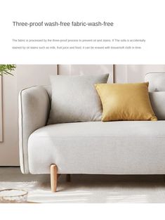 a white couch with two yellow pillows on it and the caption three - proof wash - free fabric - wash - free