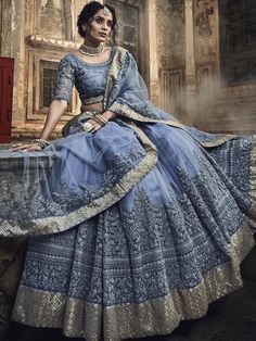 Pleasing grey embroidered wedding lehenga choli for upcoming grand events. This elegent lehenga cholis set comprise net with net blouse and net dupatta. Chania Choli, Grey Lehenga, Net Lehenga Choli, Lehenga Choli Wedding, Designer Lehengas, Party Wear Lehenga Choli, Blue Lehenga, Lehenga Online, Net Lehenga