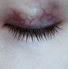 a close up view of a woman's eye