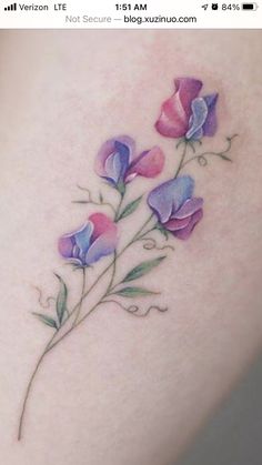 an image of a tattoo with flowers on it