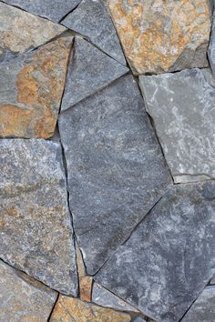 a close up view of some rocks with yellow and gray colors