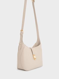 Oat Wisteria Belted Shoulder Bag Luxury Neutral Shoulder Bag, Luxury Light Luxury Shoulder Bag With Branded Hardware, Eco-friendly Beige Shoulder Bag With Rolled Handles, Light Brown Shoulder Bag With Gold-tone Hardware, Light Luxury Shoulder Bag With Gold-tone Hardware, Luxury Wishlist, Understated Glamour, Size Chart For Kids, Charles Keith