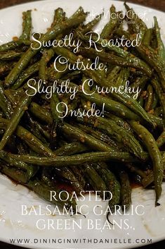 cooked green beans on a white plate with the words sweetly roasted outside slightly crunchy inside