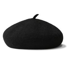 a black bean bag sitting on top of a white surface