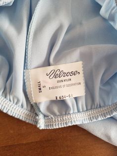 This is a pair of vintage, Velrose, Little Bo Peep style, bloomers/pantaloons or tap pants. They are a size 5 and are pale blue with white lace trim. These are a high-waisted undergarment. I don't think have never been worn. They have red lines on the tag. The measurements are as follows: (All measurements taken flat and only the waist is fully extended.) Waist (elastic band): 9.25 inches, up to 16 inches Length to the elastic on the leg: 15 inches Hips: 18.5 inches Inseam to elastic on the leg: Vintage Fitted Bottoms With Elastic Waistband, Vintage Stretch Bottoms With Elastic Waistband, Vintage Fitted Bottoms For Loungewear, Fitted Vintage Bottoms For Loungewear, Vintage Fitted Loungewear Bottoms, Vintage Stretch Short Length Bottoms, Blue Stretch Vintage Bottoms, Vintage Stretch Blue Bottoms, Blue Vintage Stretch Bottoms