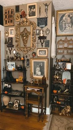 a living room filled with furniture and pictures on the wall