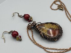 Gorgeous burgundy and olive teardrop stone necklace, wire wrapped in antique copper wire includes matching dangle earrings with clusters. This set would make a sweet gift for someone special! Pendant And Earring Set, Jasper Pendant, Wrapped Pendant, Wire Wrapped Pendant, Star Pendant, Wire Wrapped Jewelry, Antique Copper, Stone Necklace, Copper Wire