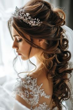 a woman wearing a wedding dress with a tiara on her head