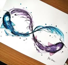 an artistic drawing of two fish in the shape of a heart on a piece of paper