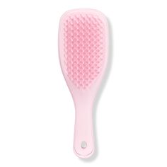 The Mini Ultimate Detangler Hairbrush - MINI ULTIMATE DETANGLER MILLENNIALBenefitsPatented teeth have two-tiered technology with added flex for wet hair. The long, flexible teeth detangle, removing knots and reducing breakage, while the short teeth smooth, for glossy, frizz-free hair.Although small, it confidently detangles any type of hair, helping to reduce hair breakage.You can use on dry or wet hair, it's great for detangling ends and fringes and for distributing conditioning treatments through wet hair.FeaturesThe Ultimate Detangler is the perfect size for travel, and has a savvy keyring hole on the handle that allows you to clip to your bag.Don't be fooled by the size, this hairbrush confidently detangles wet and dry hair. - The Mini Ultimate Detangler Hairbrush Pink Detangling Brush, Preppy Hair Brush, Hairbrush For Curly Hair, Tangle Teaser Brush, Hair Care Products Aesthetic, Beach Jobs, Pink Hairbrush, Tangle Teezer Brush, Mini Hairbrush