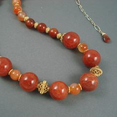 Crackle Agate and Carnelian Necklace is adjustable 17 to 20 inches. Strand of Red Crackle Agate and Tangerine Carnelian is accented with Gold Fill  beads. It closes with a gold fill lobster claw clasp. Red Crackle, Carnelian Necklace, 16 29, Lobster Claws, Fire Opal, Lobster Claw, Gold Filled, Sterling Silver Rings, Agate