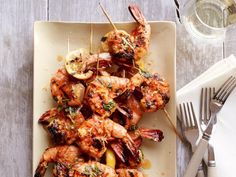 grilled shrimp skewers on a white plate