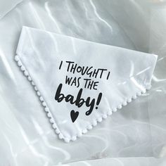 a napkin with the words i thought it was the baby written on it and a heart