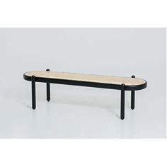 a black and white bench sitting on top of a table