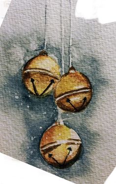 three acorns hanging from strings with faces drawn on them, painted in watercolor