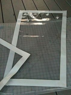 three pieces of clear plastic sitting on top of a wooden floor