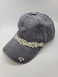 This is a new product from Handmade MKE! This is a distressed gray one size fits all baseball cap with a hole for your ponytail in the back, it is also adjustable. On the front of the hat is band of clear rhinestones, marquise opal stones, sequins and beads. On the brim of the hat are three more opals and a single circular rhinestone. This is very comfortable, and great to throw on with a plain white T-shirt! Like our Facebook Page and get 10% off when you message me before checkout! Everything Hat Embellishments, Custom Baseball Hats, Hat Ponytail, Baseball Mom Gifts, Girl Baseball Cap, Custom Embroidered Hats, Ponytail Baseball Cap, High Pony, Plain White T Shirt