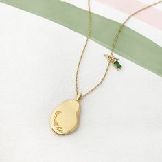 Breathe Gold Mantra Necklace – Wanderlust + Co Luxury Modern Stamped Jewelry, Luxury Brass Necklace For Gift, Spiritual Gold Plated Initial Pendant Necklaces, Gold Spiritual Initial Pendant Jewelry, Spiritual Engraved Brass Charm Necklace, Gold Pendant Necklace For Meditation, Gold Buddha Necklace, Wanderlust Necklace, Wanderlust And Co