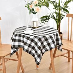 a black and white checkered table cloth on a dining room table