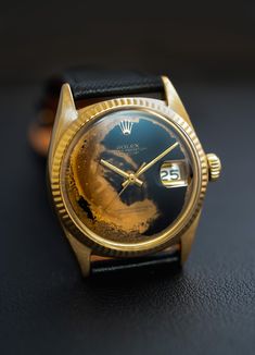 This isn’t tropical sun damage and it’s not even patina. This is Obsidian, a naturally occurring glass which forms when volcanic lava cools rapidly with minimal crystal growth. Some areas are of this volcanic dial are translucent, true glass. The areas here where you see deep gold on the dial are in fact the dial… The post Obsidian Dial 1601 Rolex Datejust first appeared on Hairspring. Men’s Gold Watch, Men’s Watch, Unique Watches, Crystal Growth, Tropical Sun, Classy Watch, Timeless Watches, Rolex Date, Retro Watches