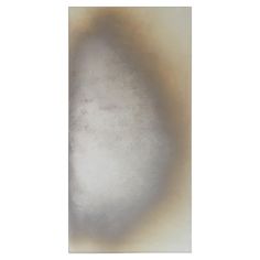 an abstract painting with white and brown colors on the bottom half of it, in front of a white background