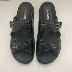 Gorgeous Coveted “Dad” Sandals Purchased At Bal Harbor Chanel Store On 7/5/2024 Worn Only Once And Are Slightly Large So Selling In Hopes Of Finding A Smaller Pair. Wear On Soles - Otherwise Pristine Condition. Just Trying To Make My Money Back (Or Close). Comes With Authenticity Cards/Box/Dust Bags/Receipt. Classic Black Slides With Branded Insole, Classic Black Slip-on Slides, Formal Black Open Heel Slides, Classic Black Slides With Rubber Sole, Classic Black Flat Slides, Luxury Slides With Rubber Sole And Round Toe, Luxury Slides With Padded Heel, Classic Slides With Leather Sole And Round Toe, Black Slip-on Sandals With Padded Heel