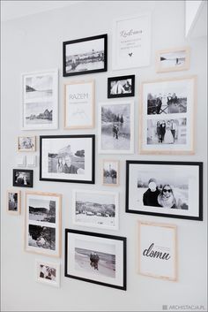 a white wall with black and white pictures on it