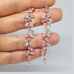 ❤️Best seller These diamond look, long and dainty bridal earrings are made with clear, round and marquise cut Cubic Zirconia chandelier pendants in Rose gold plated brass settings. The earrings dangle from high quality silver plated ear posts with clear CZ studs. The earrings have delicate sparkle and shine and would be a perfect accessory to add glamor and elegance to your bridal style! (High quality plating, Anti tarnish, Nickel free). * These chandelier earrings measure about 60mm / almost 2. Cheap Gold Bridal Earrings For Festive Occasion, Luxury Rose Gold Diamond Wedding Earrings, Statement Earrings Wedding Rose Gold, Luxury Rose Gold Round Bridal Earrings, Cheap Rose Gold Dangle Earrings, Long Rose Gold Earrings, Luxury Rose Gold Jewelry For Reception, Cheap Tarnish Resistant Rose Gold Earrings, Bridal Jewelry Rose Gold