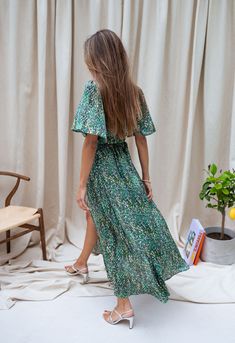 Long dress Sizing runs true to size Short sleeves Wrap front Snap button in the neckline Belt provided Not transparent Fluid Colors : green - blue Sizes : S-M / M-L S-M : Length 55.5 in - Width 18.1 inM-L : Length 57.1 in - Width 18.9 in Ophélie is 5'6", Larissa is 5'9" and both wear a size S-M Our model, Larissa wears the Beige Maze Sweater Contexture : 100% Polyester Handwash recommended Ariana Dress, Clothes Europe, Swim Summer, Blue Spring, Colors Green, Spring Summer Collection, Green Shorts, French Fashion, Summer Wear