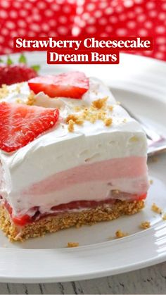 a piece of cake with strawberries on top is sitting on a plate next to a fork