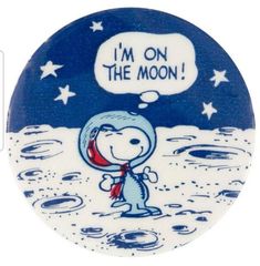 a blue and white plate with an image of a cartoon character on the moon saying i'm on the moon